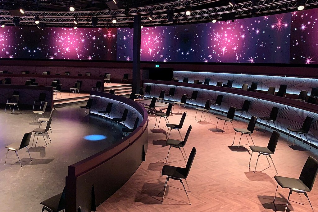 event location, digital walls, chairs placed at distance