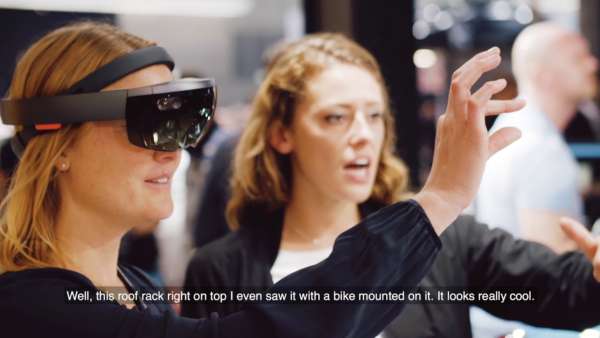 Young women at MINI Booth with VR Glasses